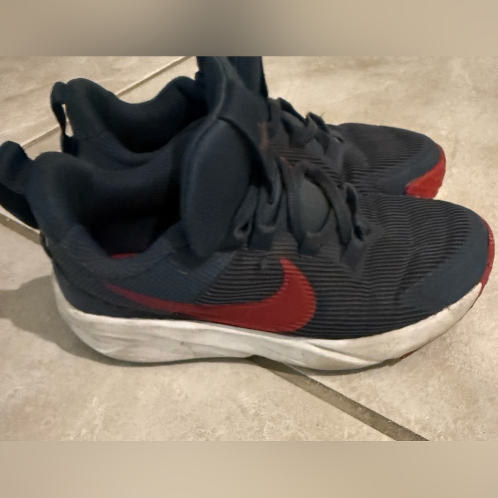 Nike Kids Navy slip on Sneakers with Red Swoosh Accent
